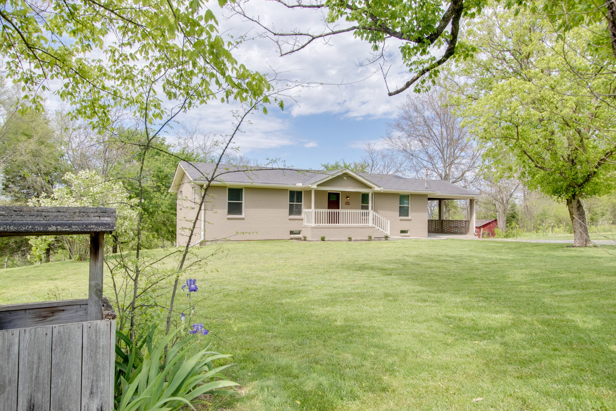 445 Tracy Road Watertown, TN 37184 - Photo 3 of 49 a front view of a house with a garden