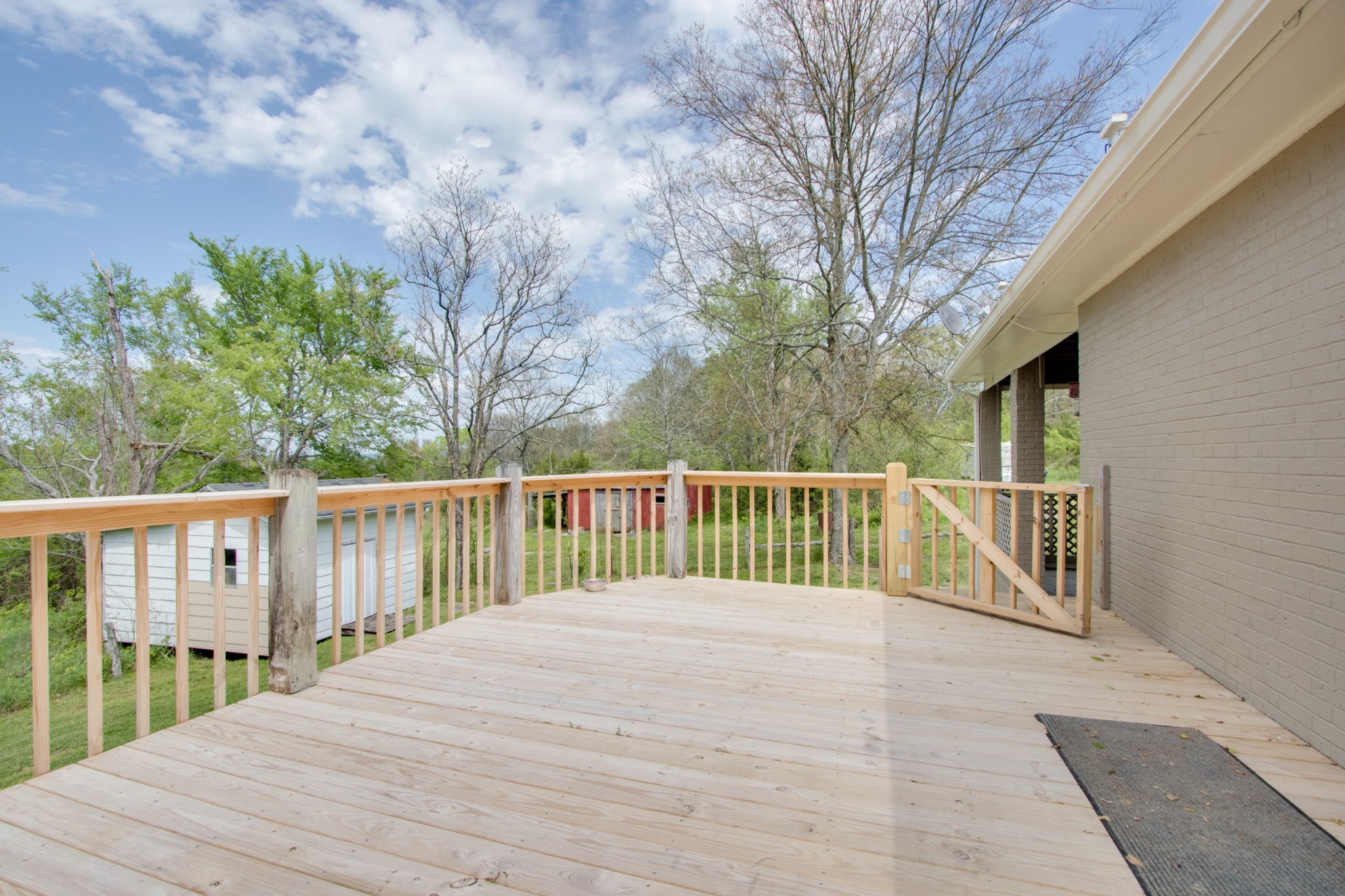 445 Tracy Road Watertown, TN 37184 - Photo 39 of 49 a balcony with trees in front of it