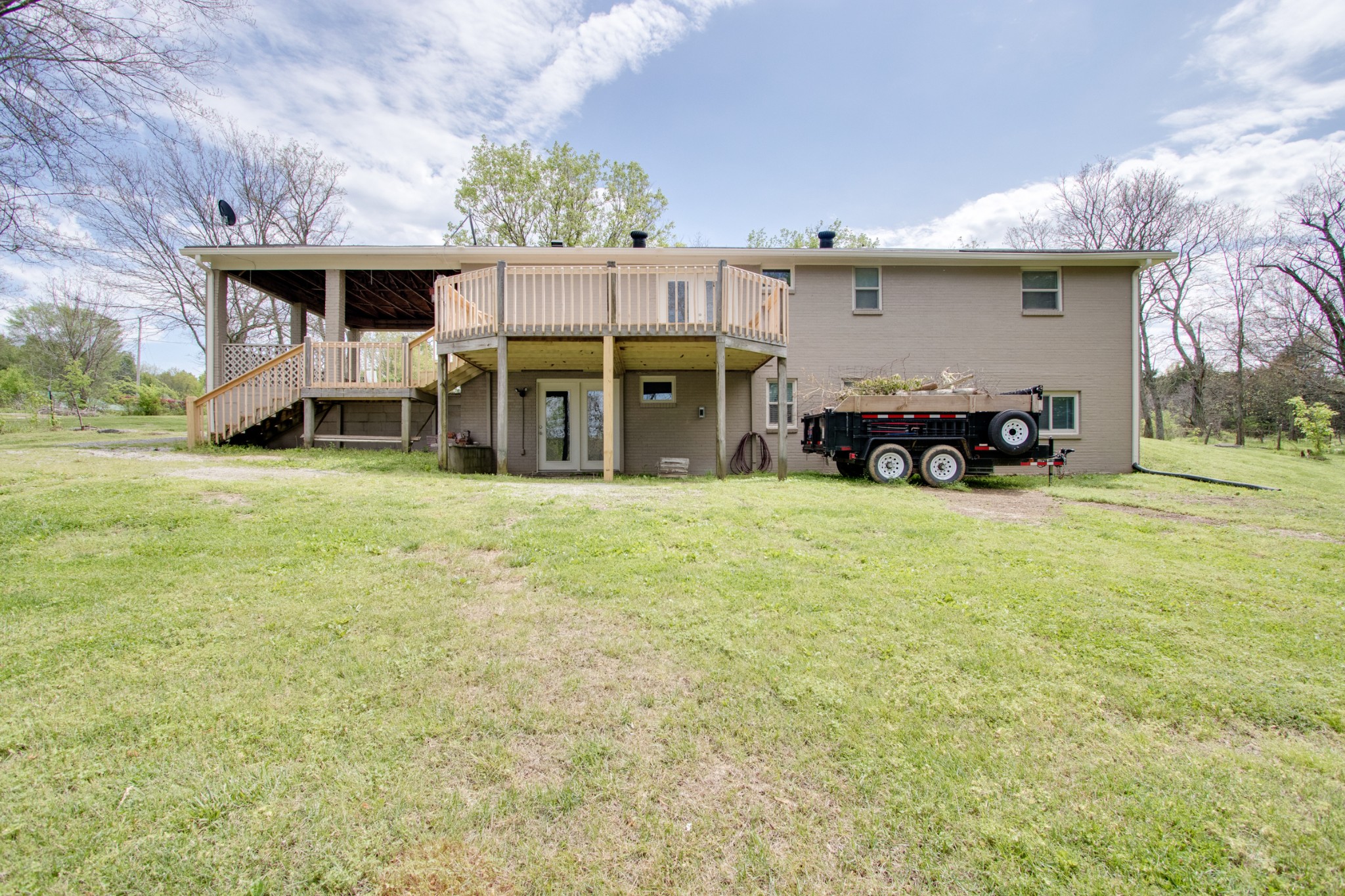 445 Tracy Road Watertown, TN 37184 - Photo 42 of 49 a view of a house with porch and chairs