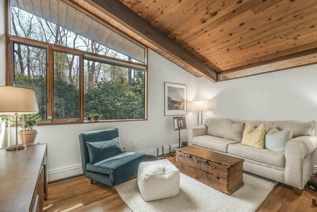 246 Heald Road Carlisle, MA 01741 - Photo 13 of 25 a living room with furniture and a large window