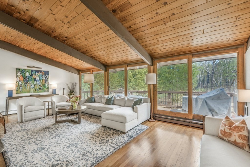 246 Heald Road Carlisle, MA 01741 - Photo 4 of 25 a living room with furniture and large windows