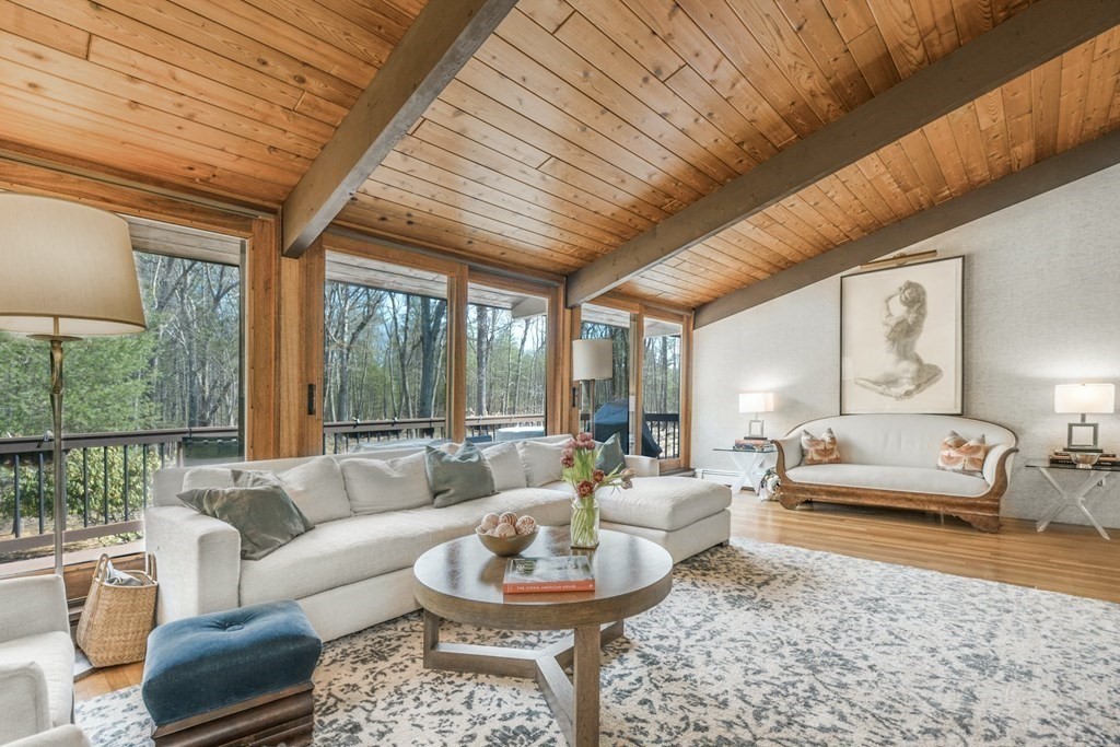 246 Heald Road Carlisle, MA 01741 - Photo 6 of 25 a living room with furniture a rug potted plant and a large window