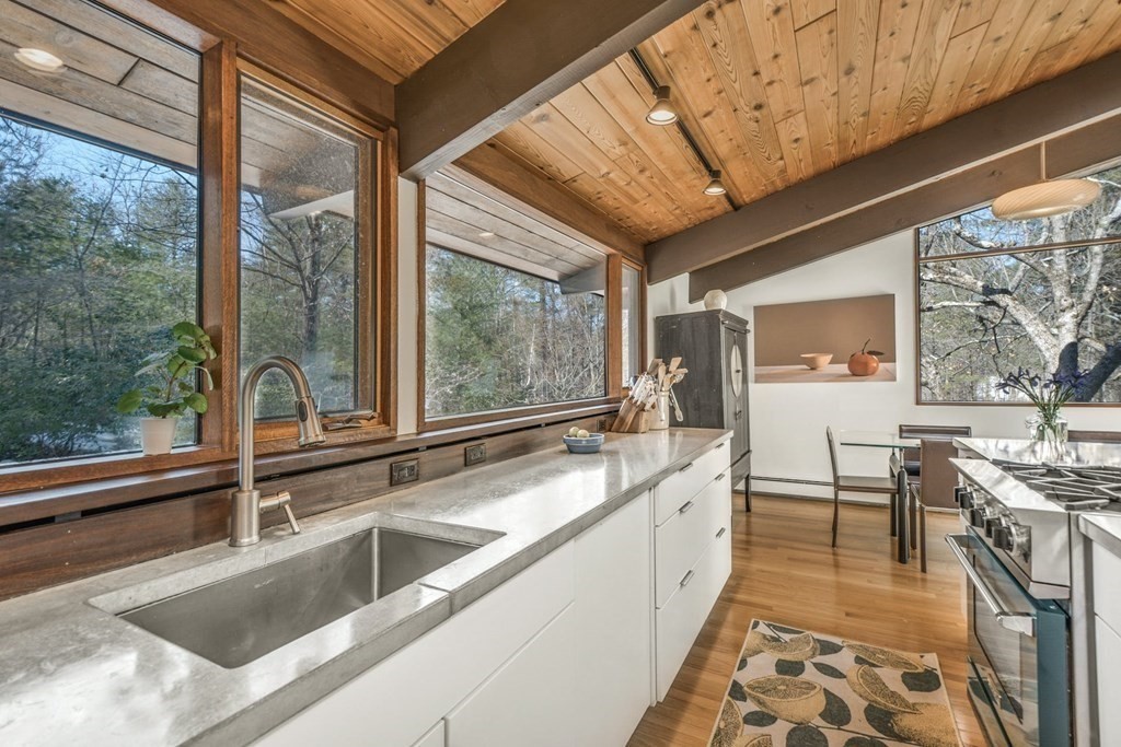 246 Heald Road Carlisle, MA 01741 - Photo 10 of 25 a large white kitchen with a large window