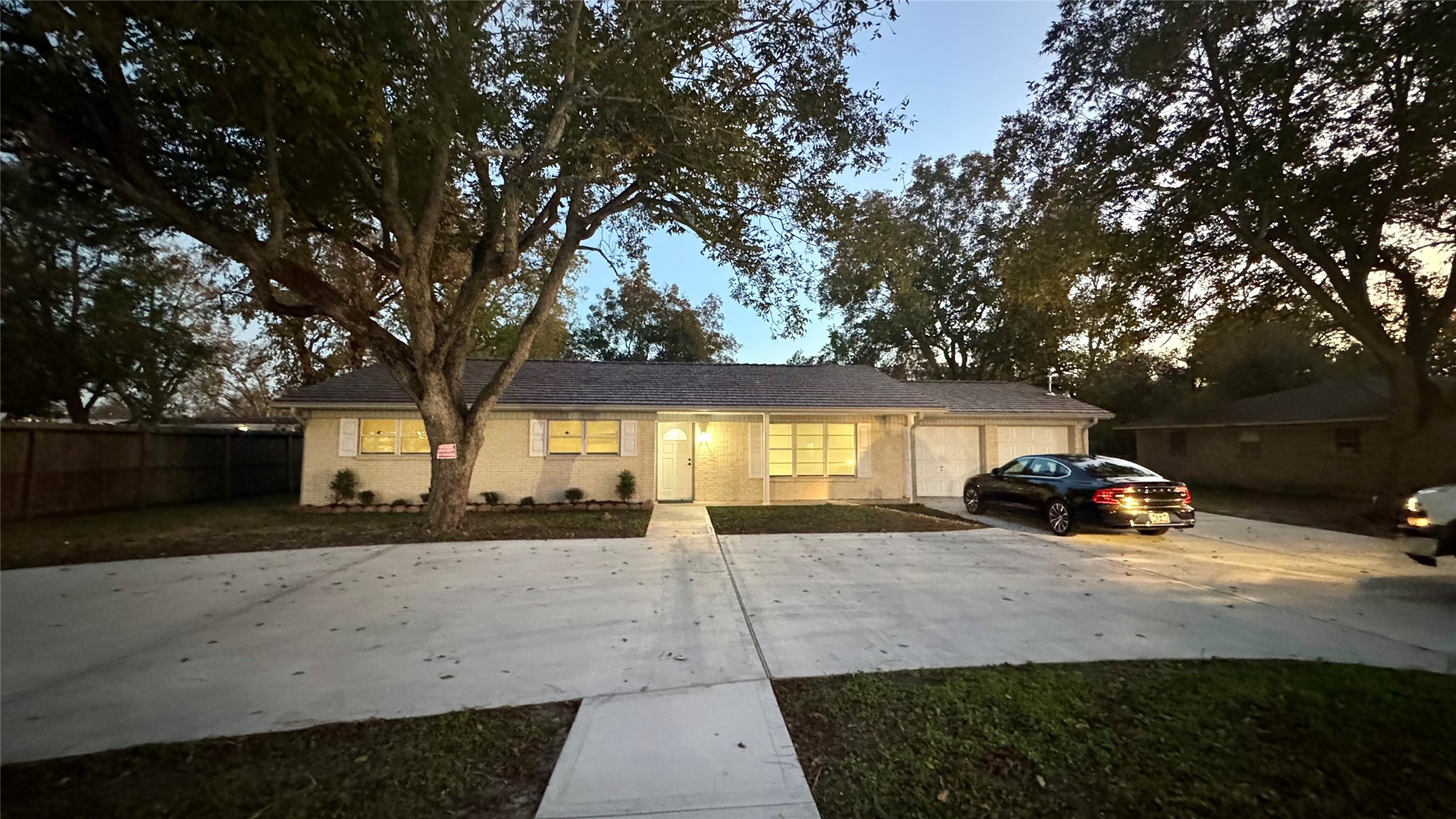 202 Massey Tompkins Road Baytown, TX 77521 - Photo 1 of 20 a front view of a house with a yard and garage