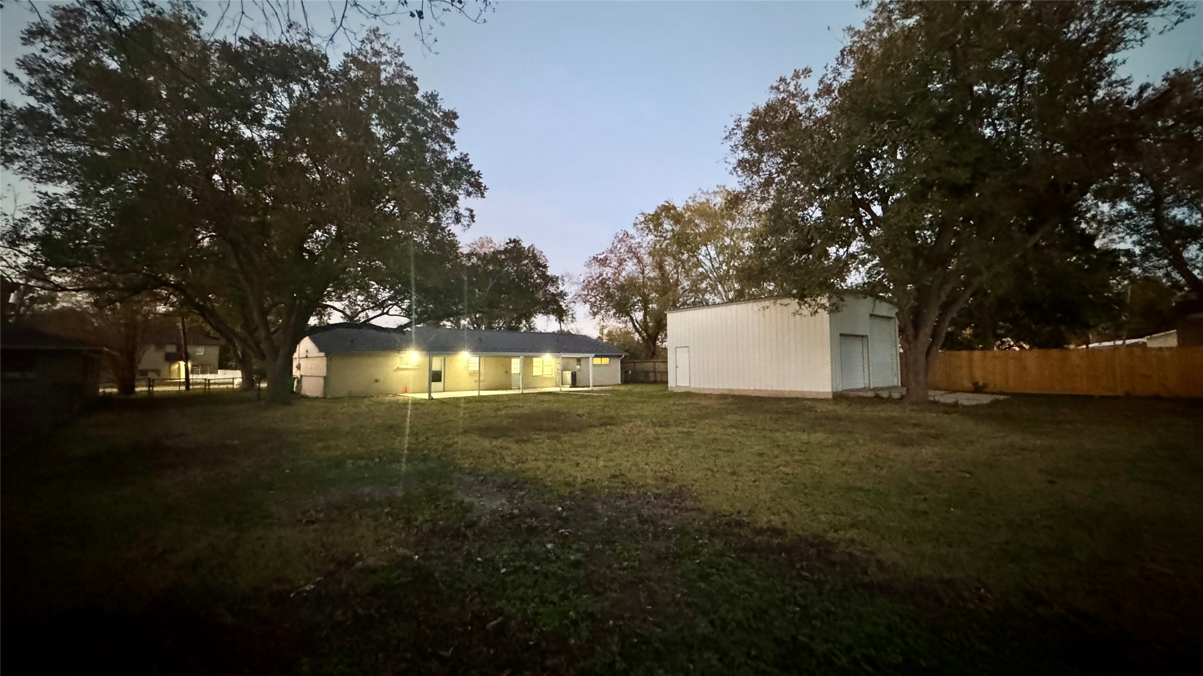 202 Massey Tompkins Road Baytown, TX 77521 - Photo 5 of 20 a backyard of a house with lots of green space