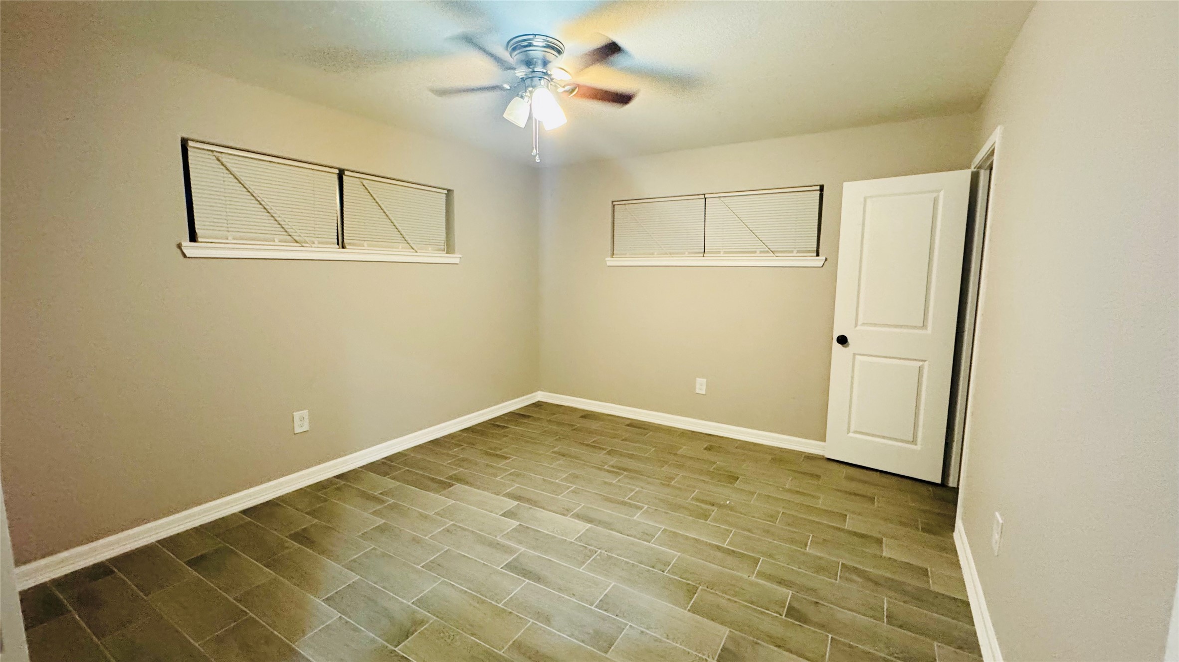 202 Massey Tompkins Road Baytown, TX 77521 - Photo 7 of 20 a view of an empty room with a window