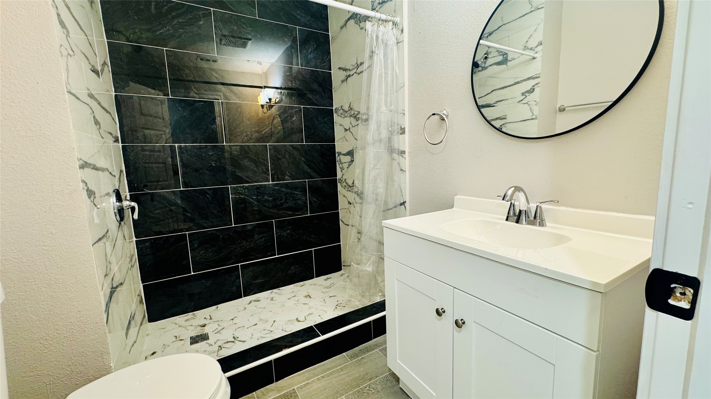 202 Massey Tompkins Road Baytown, TX 77521 - Photo 10 of 20 a bathroom with a sink toilet and shower