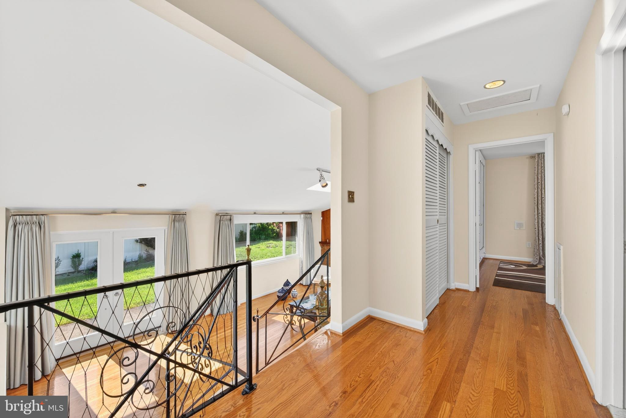 914 Kenbrook Court Silver Spring, MD 20902 - Photo 21 of 35 a view of a hallway with wooden floor and staircase
