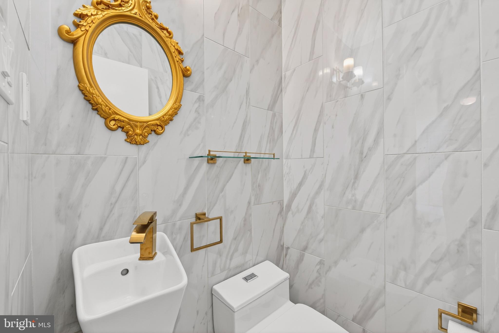 914 Kenbrook Court Silver Spring, MD 20902 - Photo 24 of 35 a bathroom with a sink and a mirror