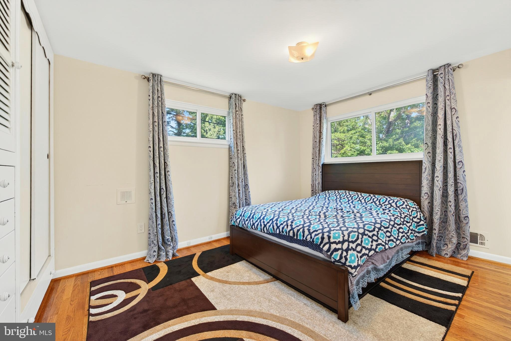 914 Kenbrook Court Silver Spring, MD 20902 - Photo 27 of 35 a bed sitting in a bedroom next to a window