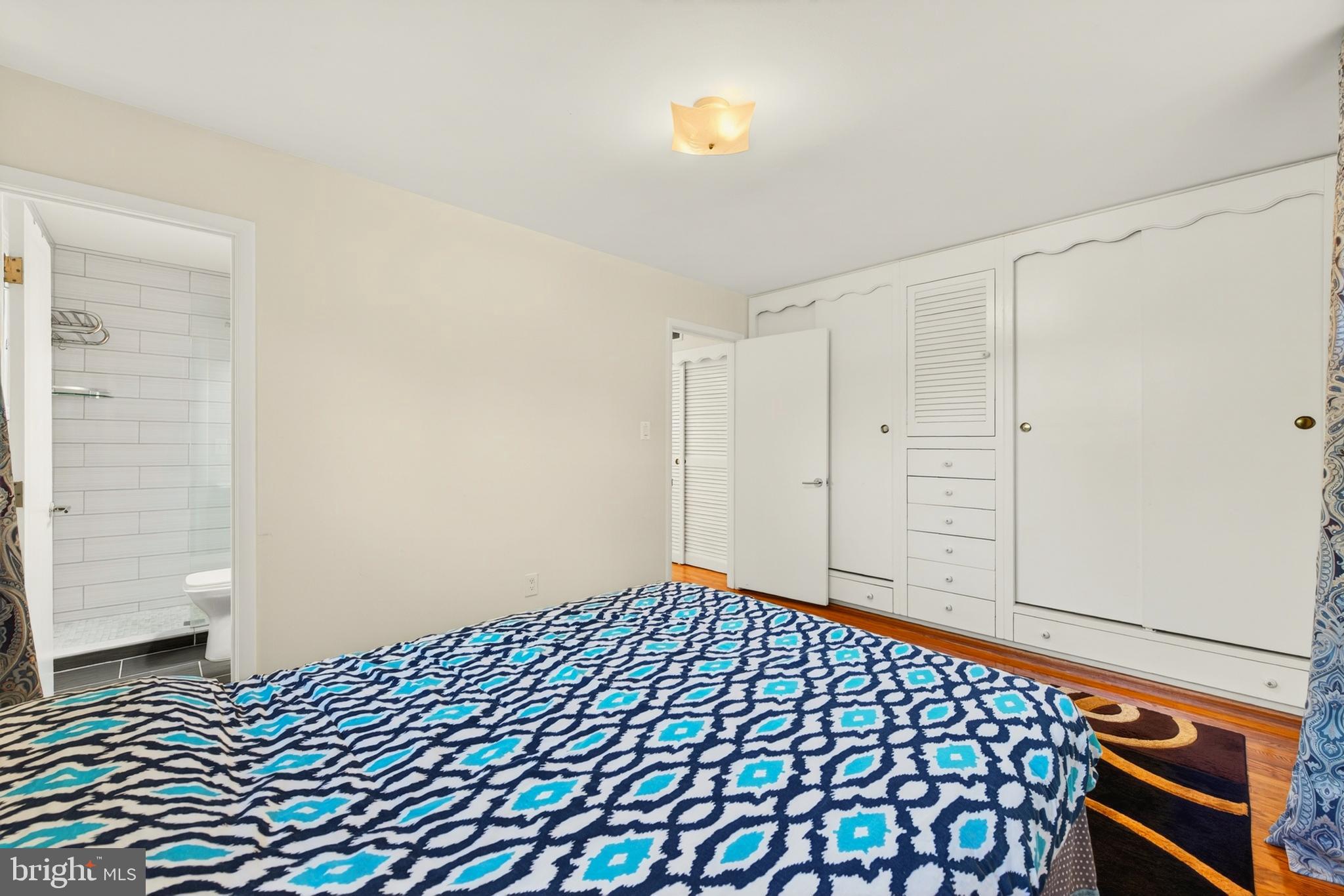 914 Kenbrook Court Silver Spring, MD 20902 - Photo 28 of 35 a bedroom with a bed and a shower