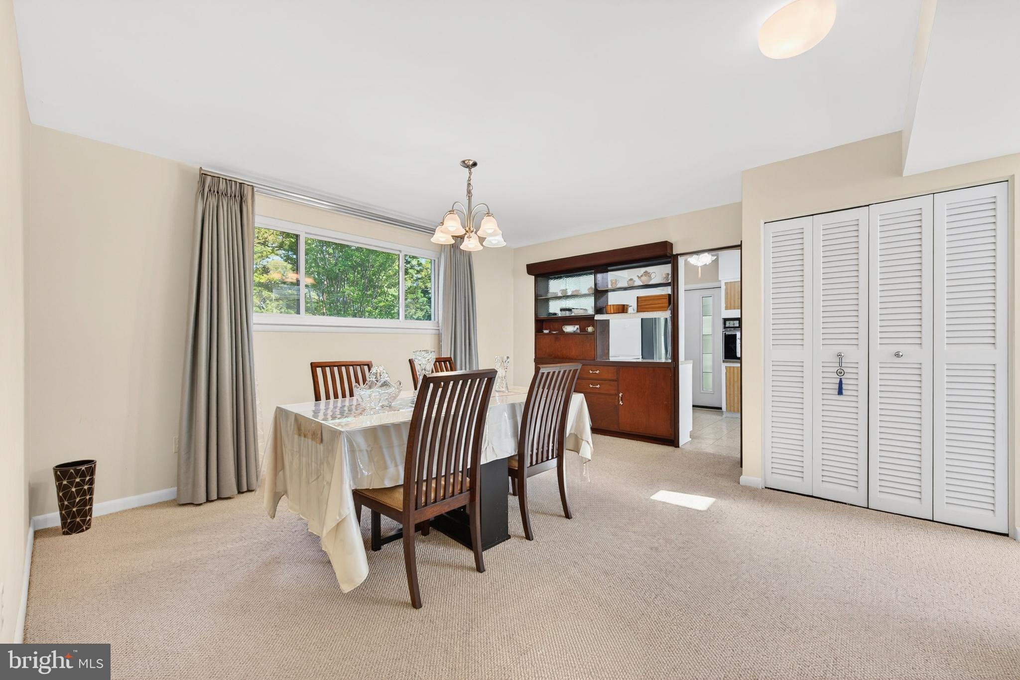 914 Kenbrook Court Silver Spring, MD 20902 - Photo 3 of 35 a view of a dining room with furniture window and outside view
