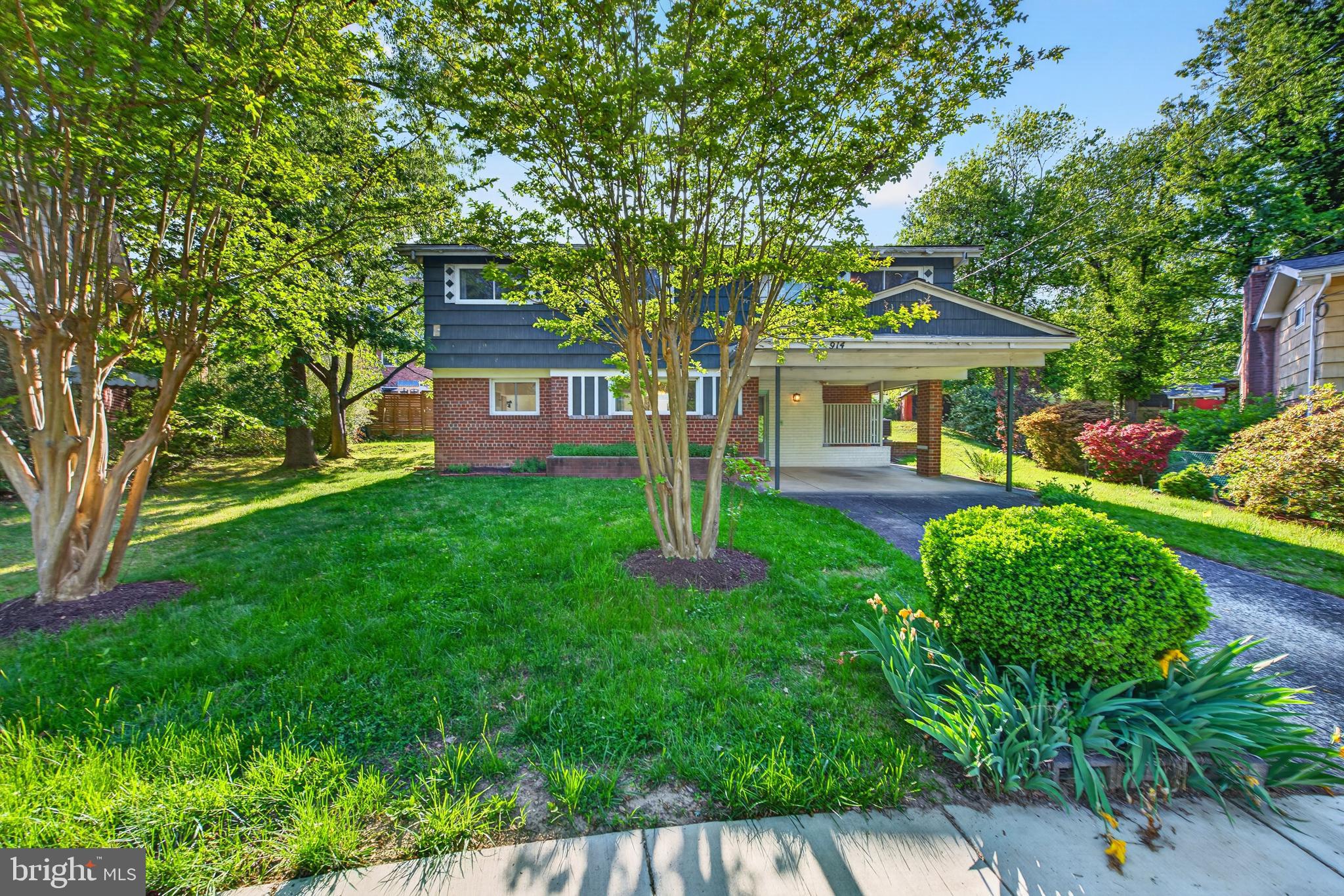 914 Kenbrook Court Silver Spring, MD 20902 - Photo 35 of 35 a front view of a house with garden