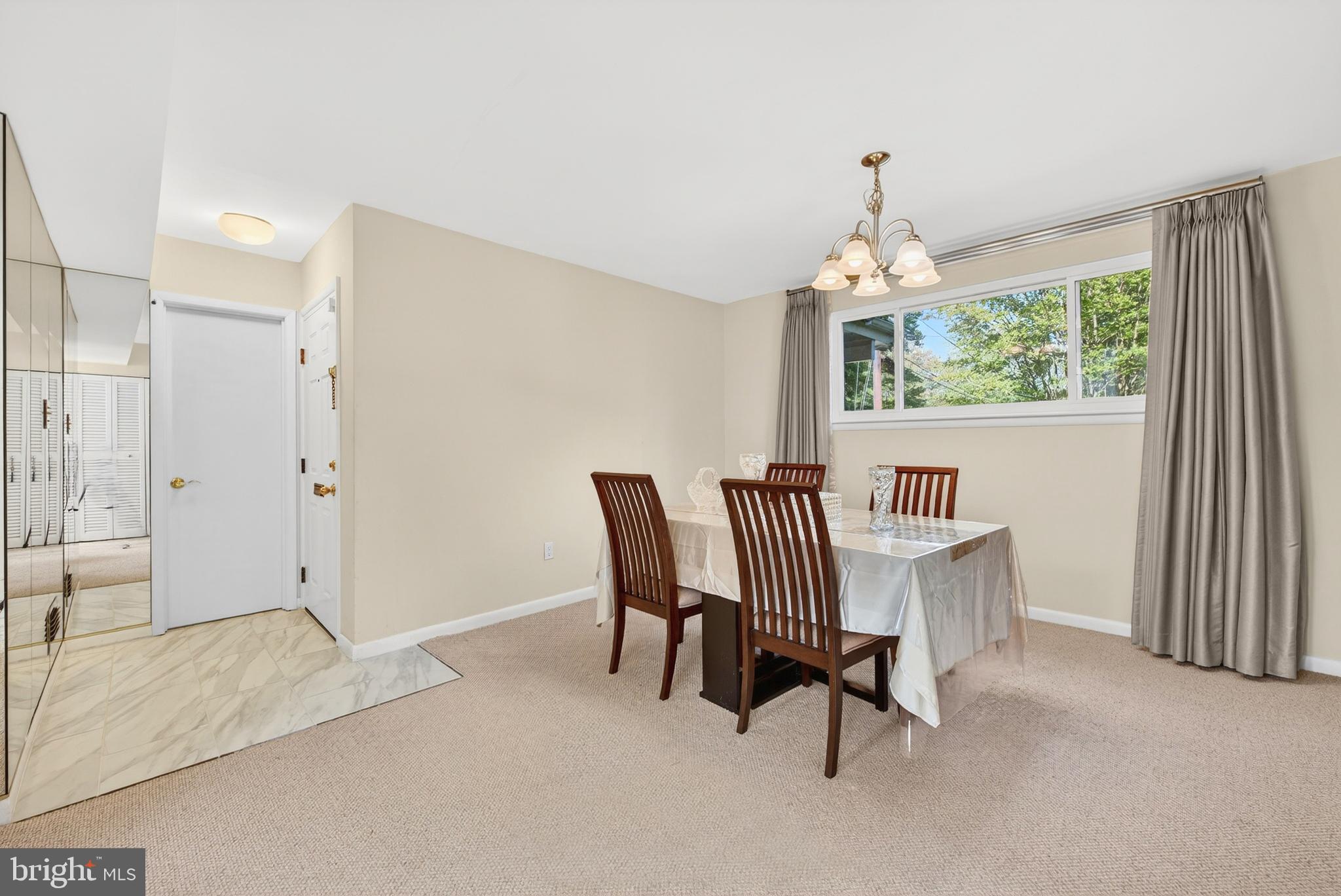 914 Kenbrook Court Silver Spring, MD 20902 - Photo 4 of 35 a view of a dining room with furniture window and outside view