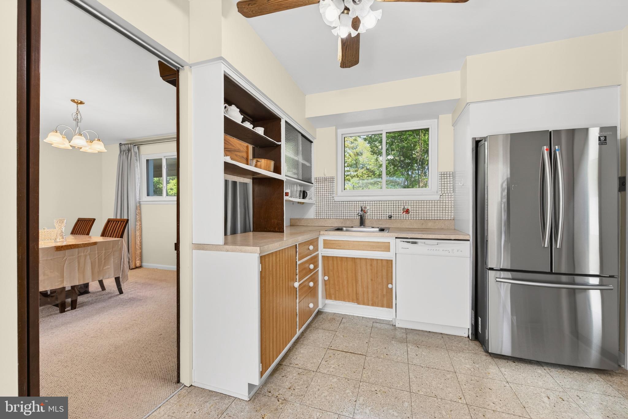 914 Kenbrook Court Silver Spring, MD 20902 - Photo 6 of 35 a kitchen with stainless steel appliances granite countertop a refrigerator and a sink
