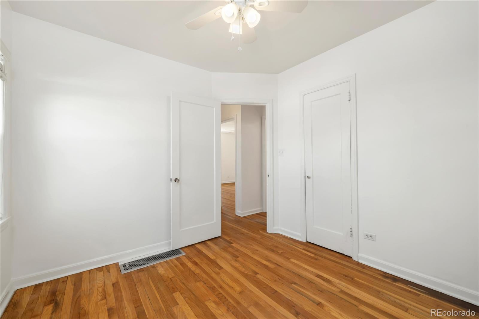 2570 Jay Street Edgewater, CO 80214 - Photo 16 of 26 a view of an empty room with wooden floor