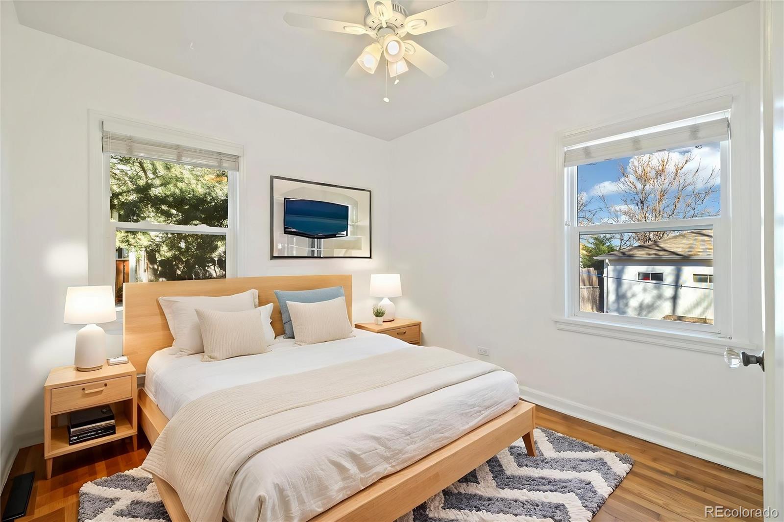 2570 Jay Street Edgewater, CO 80214 - Photo 17 of 26 a bedroom with a large bed and a window