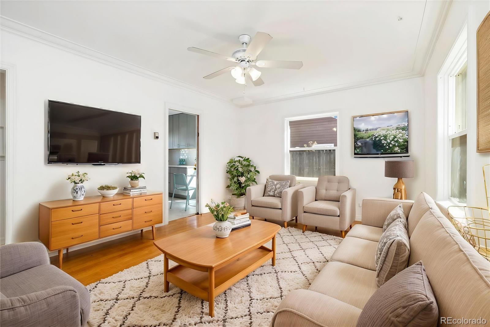 2570 Jay Street Edgewater, CO 80214 - Photo 4 of 26 a living room with furniture and a flat screen tv