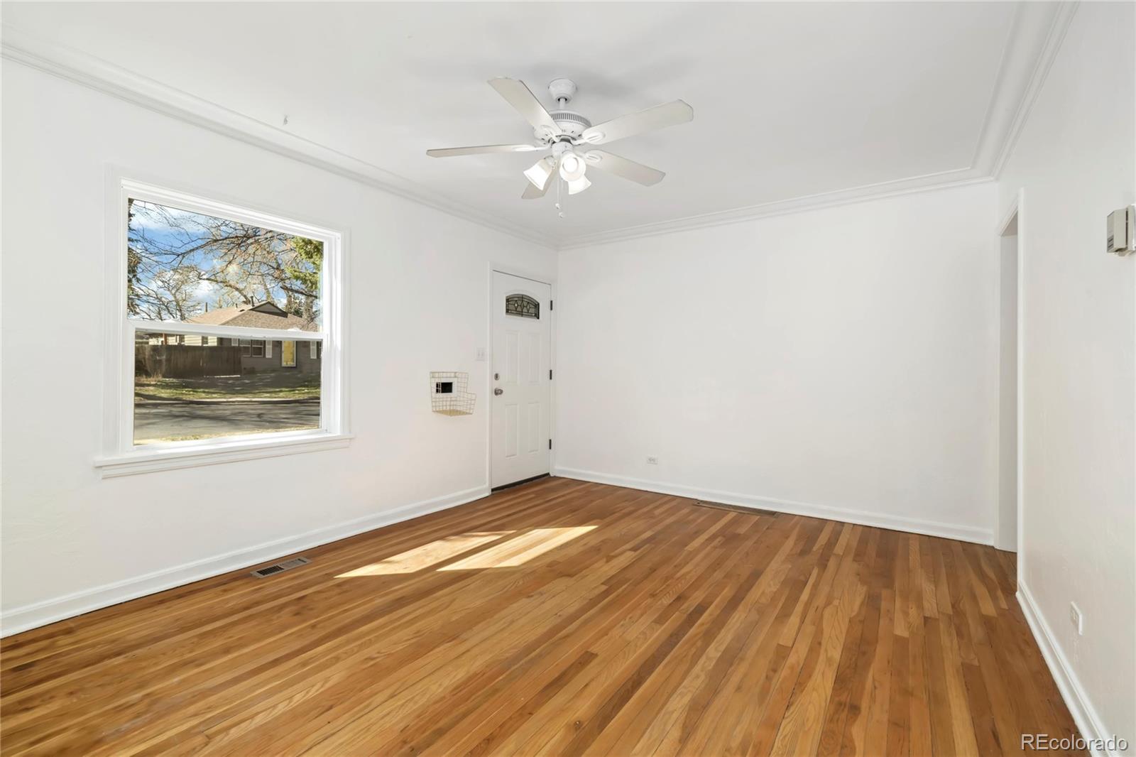 2570 Jay Street Edgewater, CO 80214 - Photo 8 of 26 wooden floor in an empty room with a window