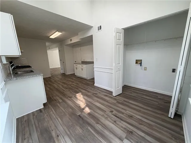 a view of a kitchen from the hallway