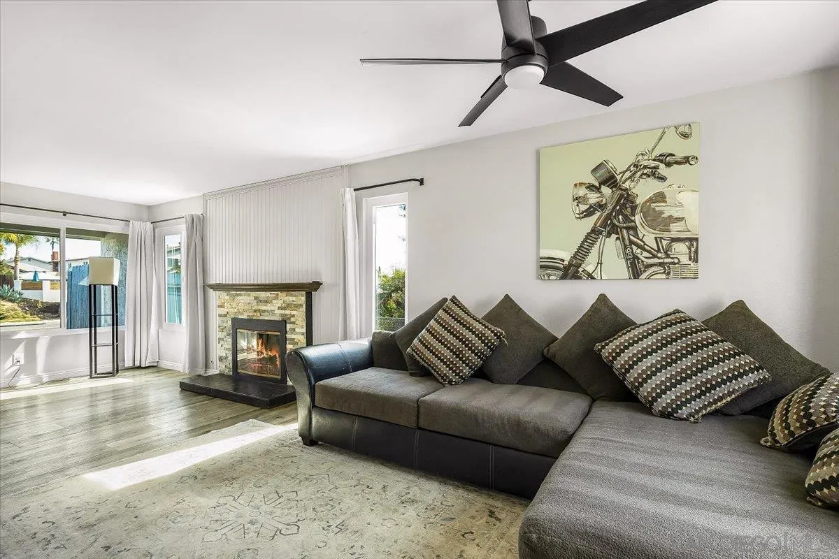 8335 Carlton Oaks Drive Santee, CA 92071 - Photo 13 of 32 a living room with furniture and a fireplace