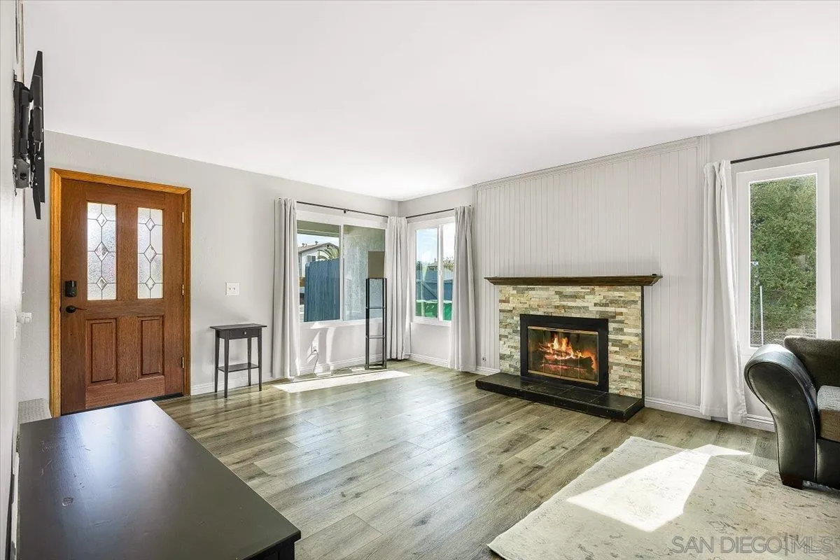 8335 Carlton Oaks Drive Santee, CA 92071 - Photo 14 of 32 a living room with furniture and a fireplace
