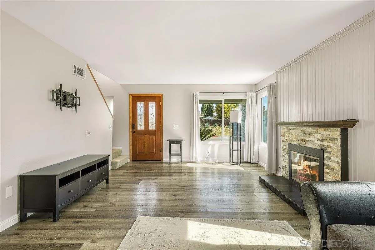 8335 Carlton Oaks Drive Santee, CA 92071 - Photo 15 of 32 a living room with furniture and a fireplace