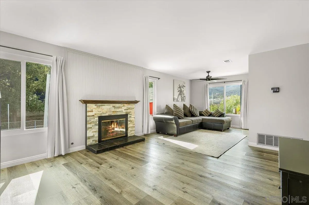8335 Carlton Oaks Drive Santee, CA 92071 - Photo 17 of 32 a living room with furniture and a fireplace