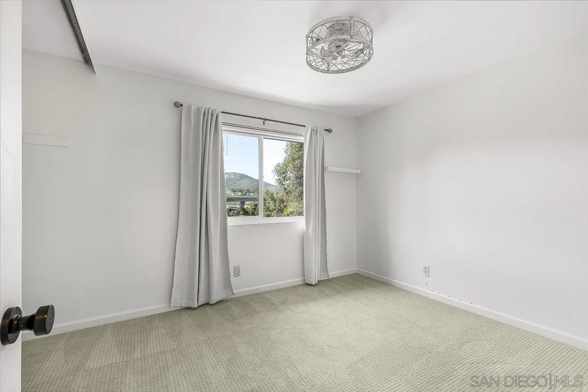8335 Carlton Oaks Drive Santee, CA 92071 - Photo 20 of 32 a view of a room that has a window in it