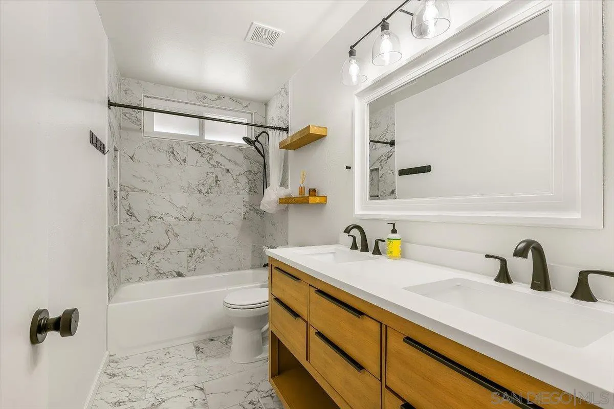 8335 Carlton Oaks Drive Santee, CA 92071 - Photo 21 of 32 a bathroom with a sink a toilet and shower