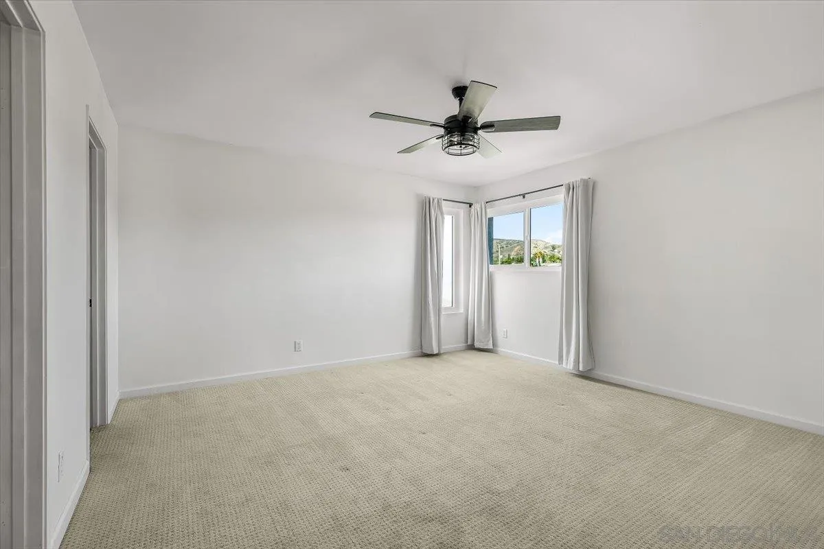 8335 Carlton Oaks Drive Santee, CA 92071 - Photo 23 of 32 a view of an empty room with a window
