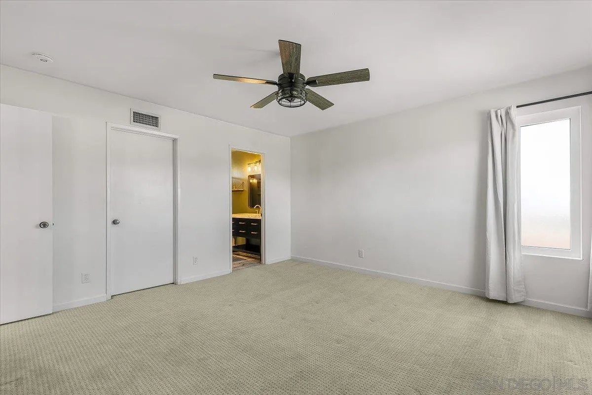 8335 Carlton Oaks Drive Santee, CA 92071 - Photo 24 of 32 an empty room with windows and closet