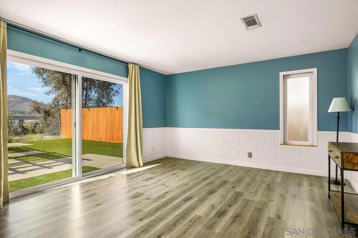 8335 Carlton Oaks Drive Santee, CA 92071 - Photo 5 of 32 a view of an empty room with a window