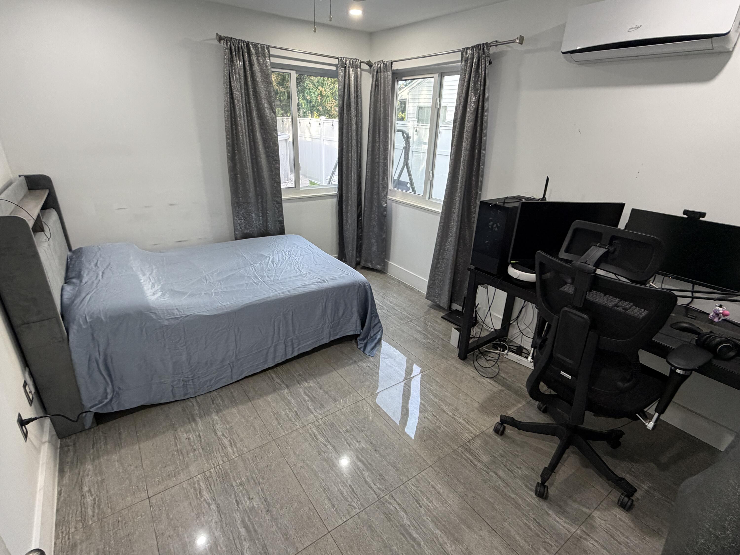 8097 Cedar Hollow Lane Boca Raton, FL 33433 - Photo 17 of 36 a bedroom with a bed a desk and chair with the wooden floor
