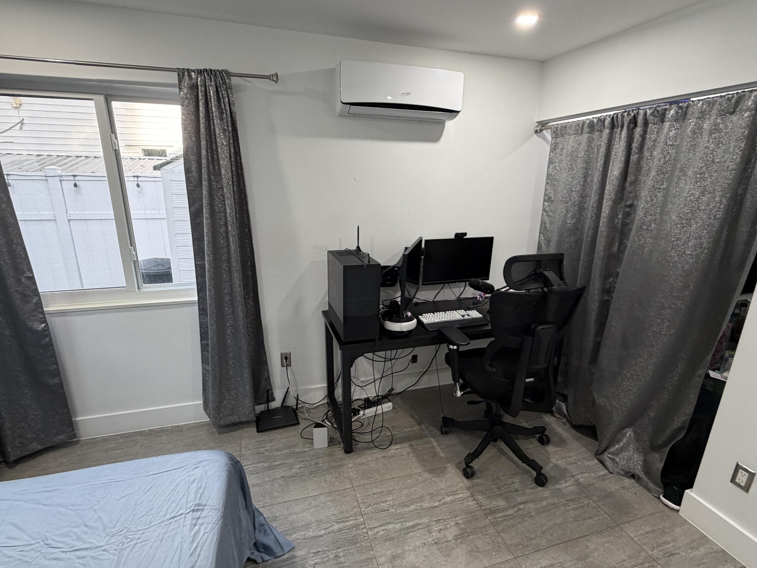 8097 Cedar Hollow Lane Boca Raton, FL 33433 - Photo 19 of 36 a view of a workspace with furniture and a window