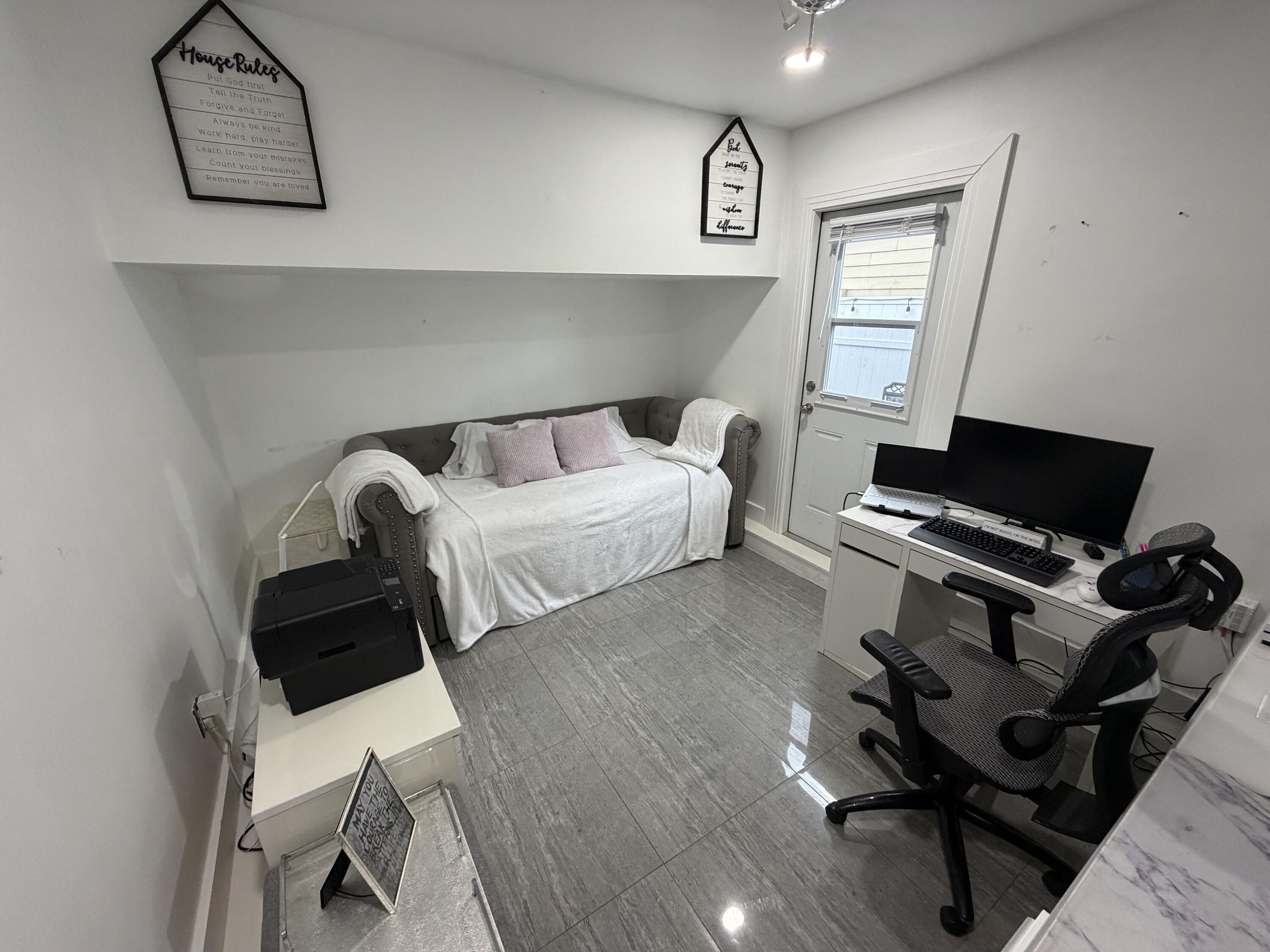 8097 Cedar Hollow Lane Boca Raton, FL 33433 - Photo 20 of 36 a bedroom with a bed and wooden floor