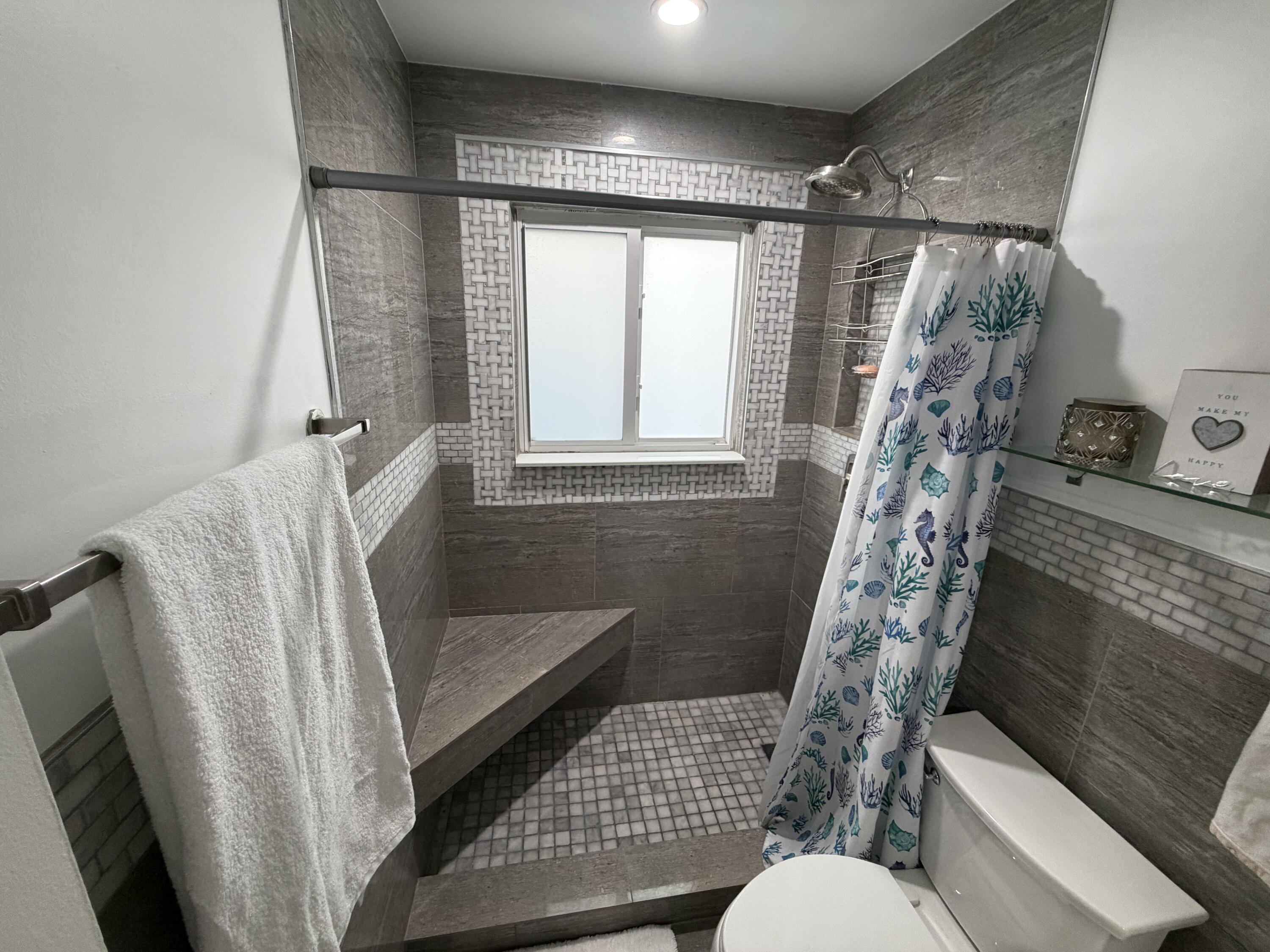 8097 Cedar Hollow Lane Boca Raton, FL 33433 - Photo 22 of 36 a bathroom with a sink toilet and shower