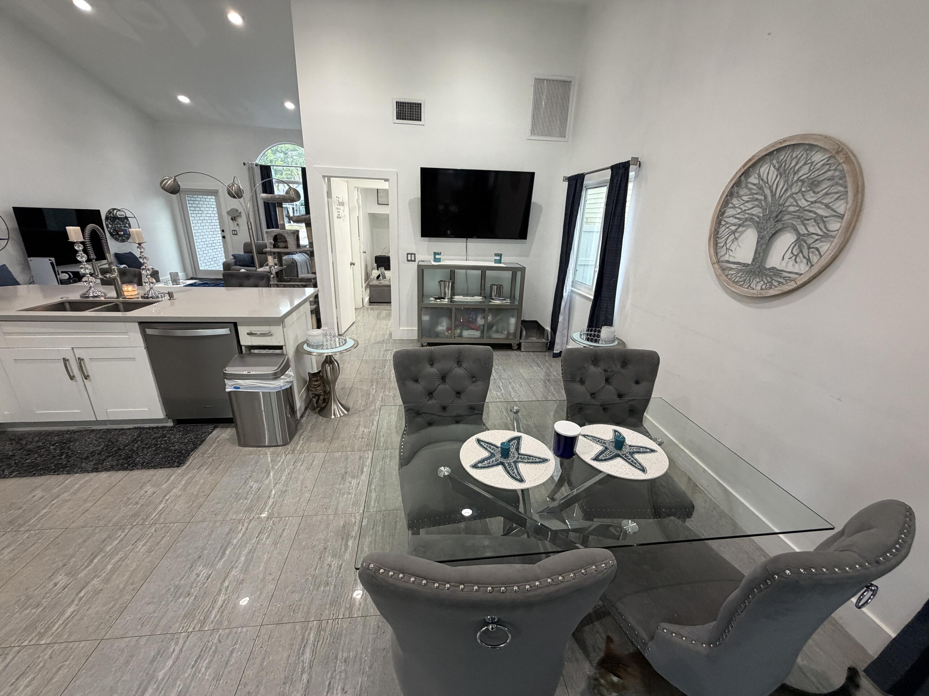 8097 Cedar Hollow Lane Boca Raton, FL 33433 - Photo 6 of 36 a living room with furniture and a flat screen tv