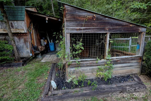 a bedroom with bed and wooden floor