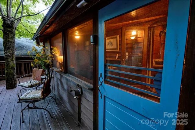 a balcony with wooden floor and fence