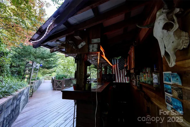 a bedroom with a bed a dresser and window