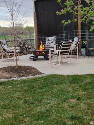 1697 West 2450 Vernal, UT 84078 - Photo 6 of 36 View of patio / terrace featuring a fire pit