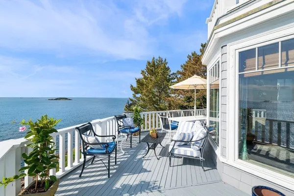 a view of a patio with a table chairs and a potted plants