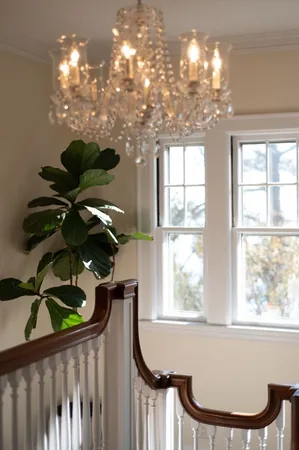 a vase of flowers sitting on a dining table
