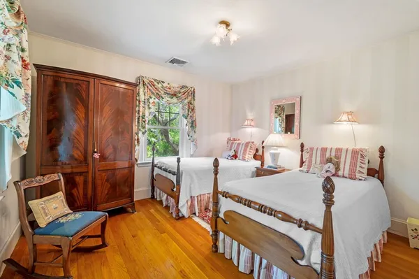 a view of a livingroom with furniture and a window