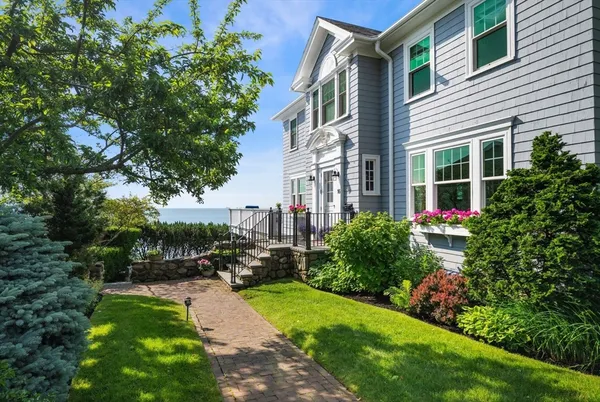 a view of backyard of house with green space