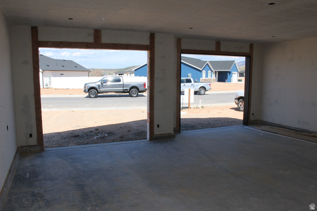 4933 East Remington Road Cedar City, UT 84721 - Photo 6 of 33 Expansive garage space featuring two large door openings