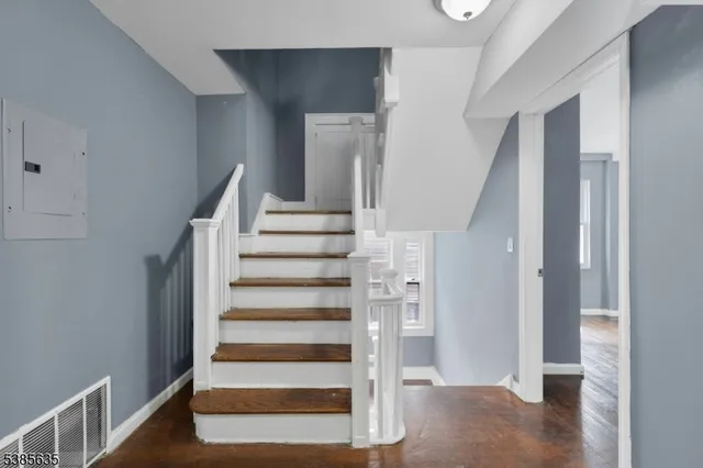 a view of entryway with wooden floor