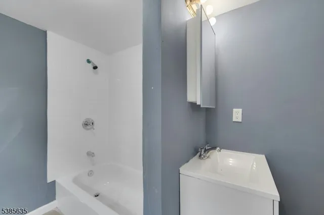 a bathroom with a sink toilet and tub