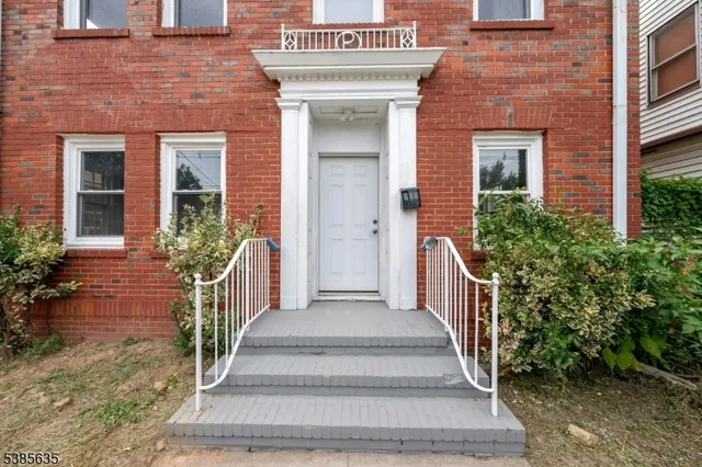 a front view of a house with a porch